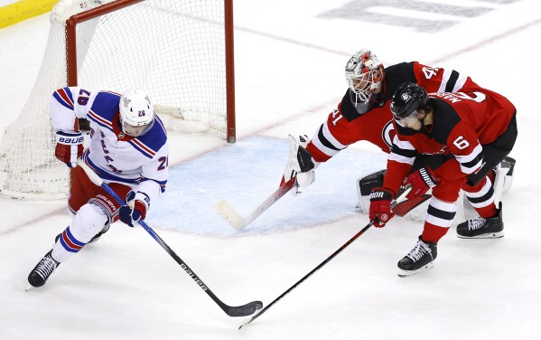 Vesey and Panarin each score twice as streaking Rangers beat rival